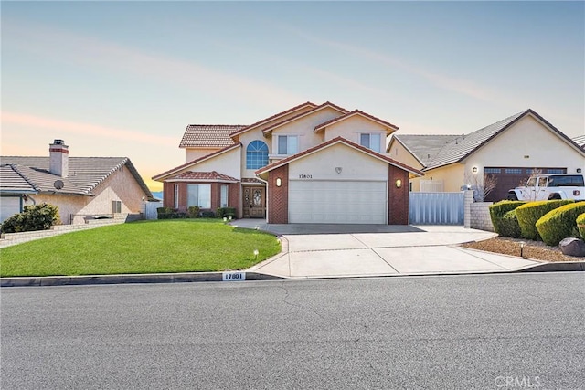 traditional home with a garage, driveway, a front yard, and fence