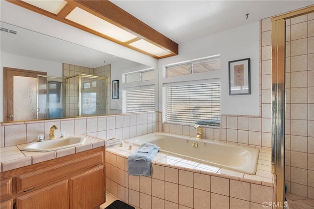 full bath with visible vents, a shower stall, vanity, and a bath