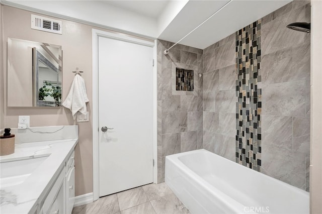 full bathroom with bathtub / shower combination, visible vents, and vanity