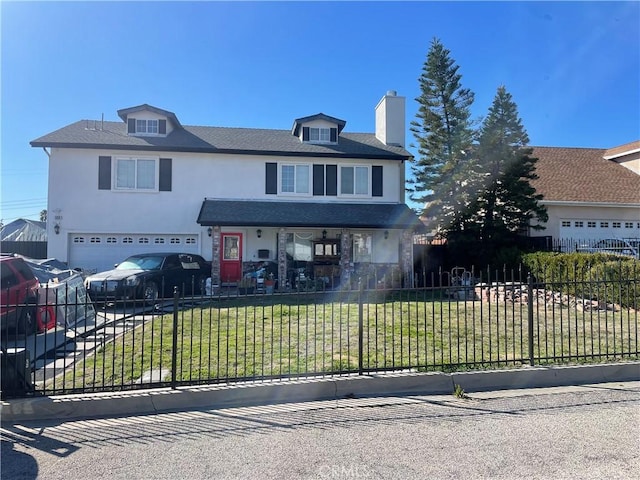 traditional-style home featuring a fenced front yard, a garage, stucco siding, and a front lawn