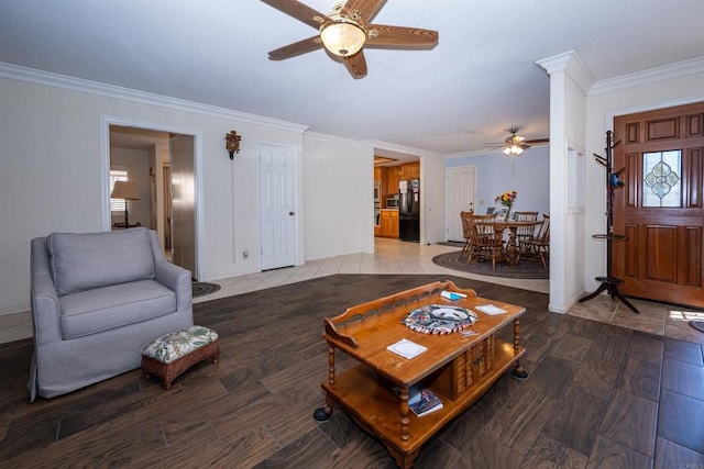living area featuring crown molding, ceiling fan, and light wood finished floors