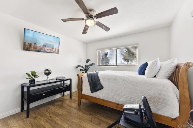 bedroom with dark wood finished floors, baseboards, and ceiling fan