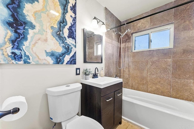 bathroom with tile patterned flooring, bathtub / shower combination, vanity, and toilet