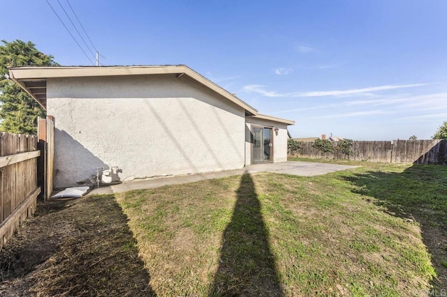 view of yard featuring a fenced backyard and a patio