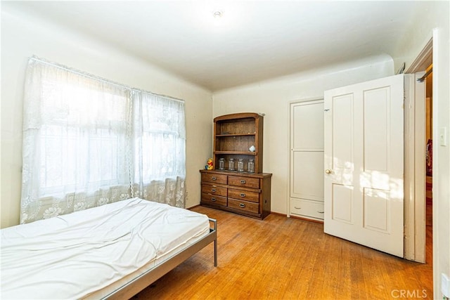 bedroom with light wood-style flooring