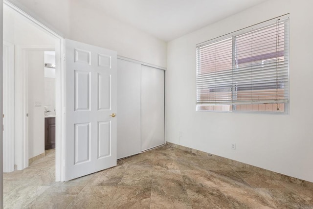 unfurnished bedroom featuring a closet