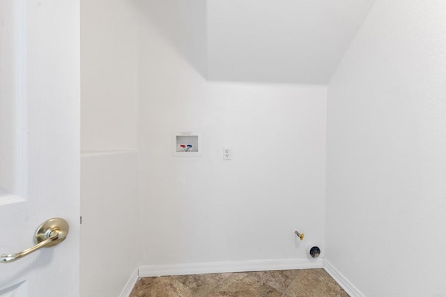 washroom featuring laundry area, hookup for a washing machine, and baseboards