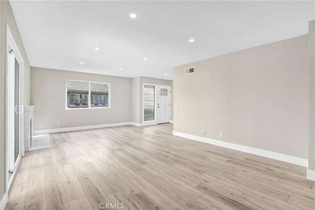 unfurnished room featuring recessed lighting, baseboards, visible vents, and light wood finished floors