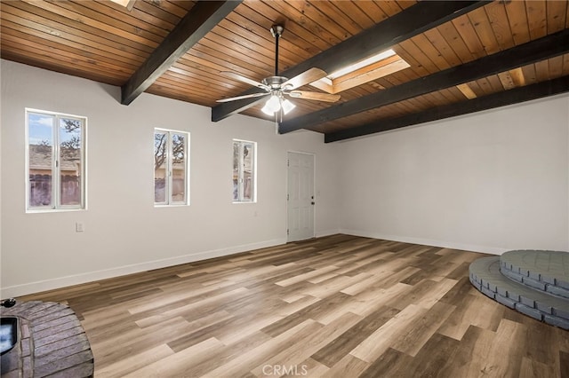 355 French St, Willows, CA 95988 - unfurnished room with light wood finished floors, beamed ceiling, a skylight, and baseboards