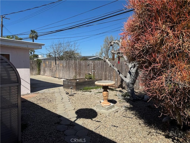 view of yard featuring a patio area and fence