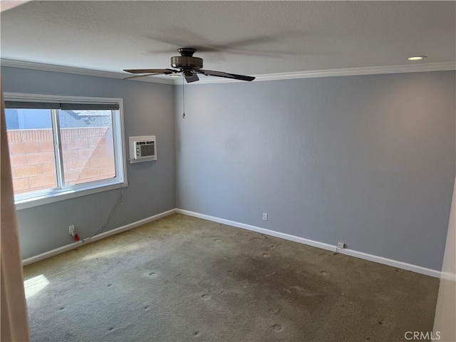 unfurnished room featuring ornamental molding, carpet, an AC wall unit, and baseboards