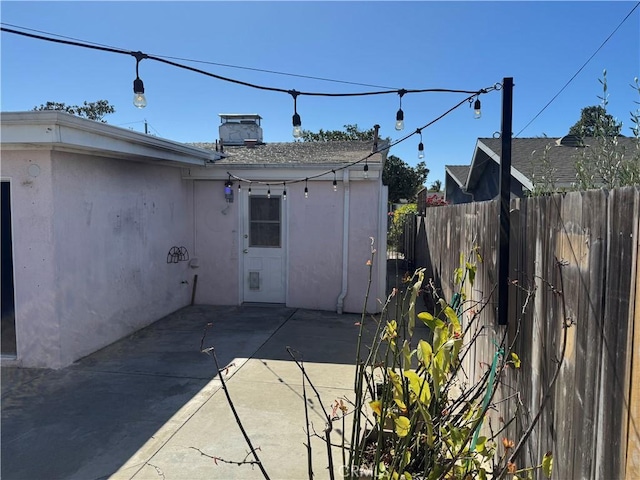 view of patio / terrace featuring fence