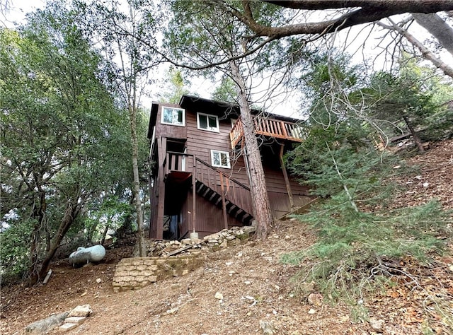 rear view of house featuring stairs