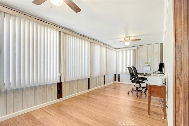 home office with a ceiling fan and wood finished floors