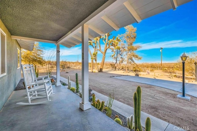 view of patio featuring a porch