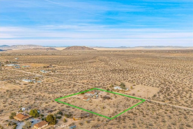 aerial view featuring view of desert and a mountain view