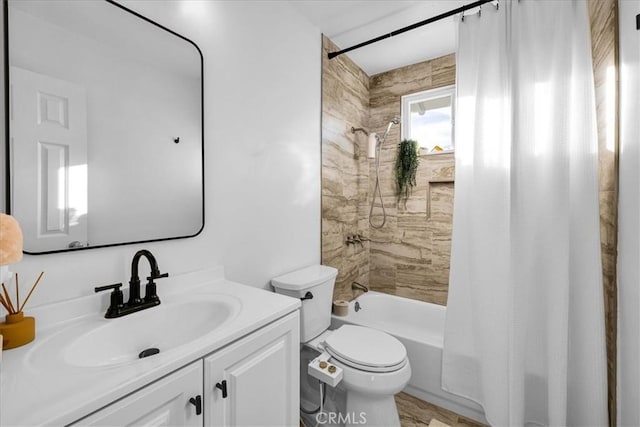 bathroom with toilet, shower / tub combo, and vanity