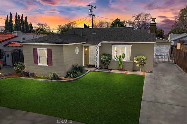 single story home with a garage, concrete driveway, a front lawn, and roof with shingles