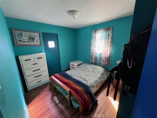 bedroom with wood finished floors