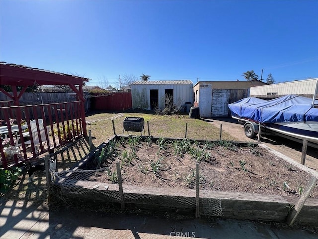 view of yard with an outdoor structure and fence