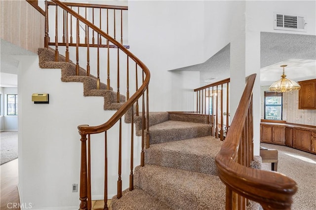 30220 Skippers Way Dr, Canyon Lake, CA 92587 - stairs featuring visible vents, plenty of natural light, and a towering ceiling