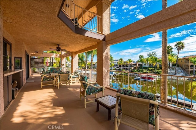 30220 Skippers Way Dr, Canyon Lake, CA 92587 - view of patio / terrace featuring outdoor dining area, a water view, ceiling fan, and a balcony