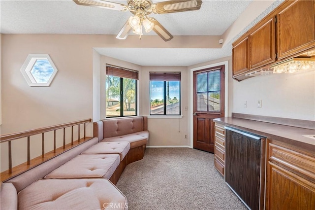 30220 Skippers Way Dr, Canyon Lake, CA 92587 - sitting room featuring ceiling fan, a textured ceiling, light carpet, baseboards, and stairway