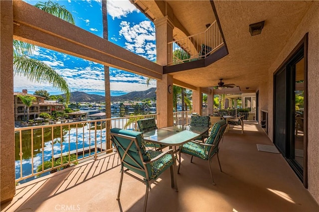 30220 Skippers Way Dr, Canyon Lake, CA 92587 - view of patio featuring a ceiling fan, outdoor dining area, a mountain view, and a balcony