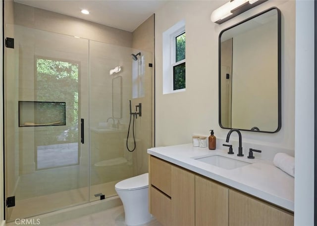 full bath featuring recessed lighting, a shower stall, toilet, and vanity