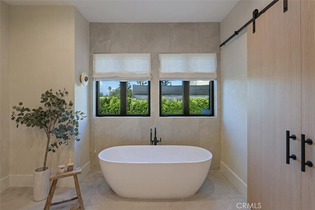 full bath featuring a freestanding tub