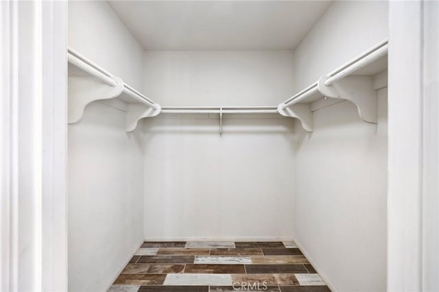 spacious closet featuring wood finish floors