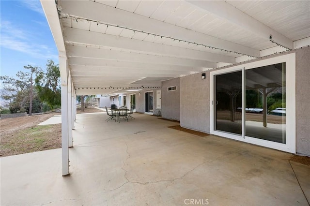 view of patio featuring outdoor dining space