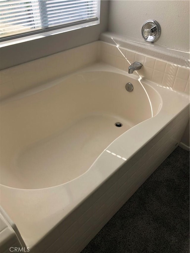 full bathroom featuring a garden tub