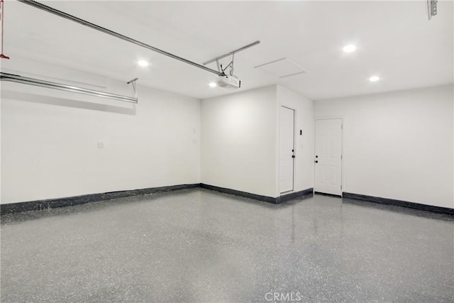 garage featuring baseboards and a garage door opener