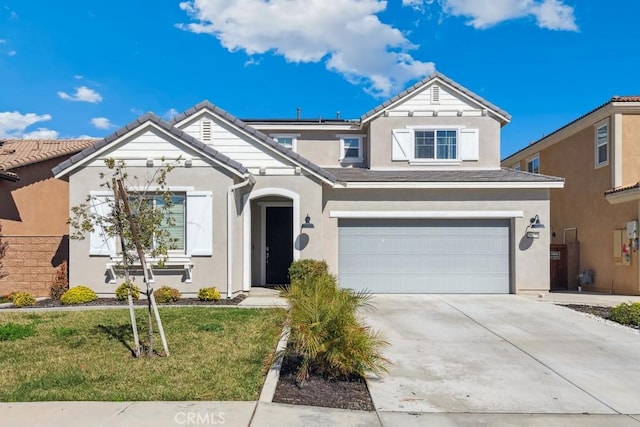 traditional-style house with a tile roof, stucco siding, an attached garage, driveway, and a front lawn