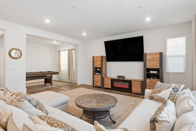 living room featuring light wood-type flooring and recessed lighting