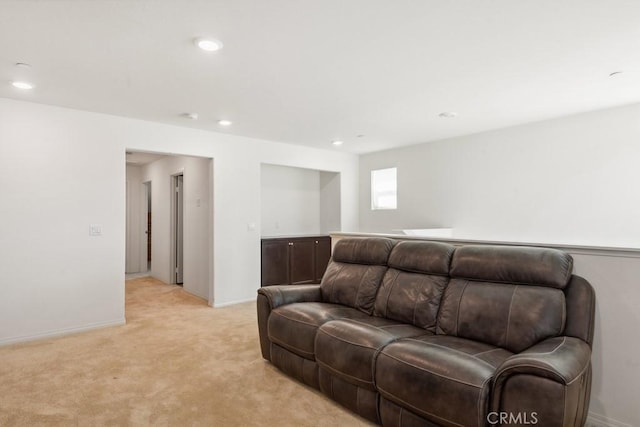 living room with light carpet, baseboards, and recessed lighting