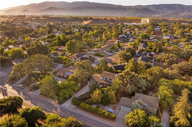 drone / aerial view featuring a residential view and a mountain view