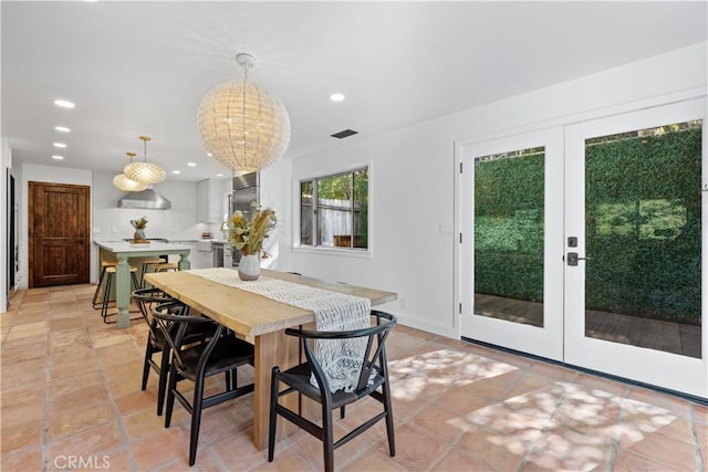 dining space with french doors, visible vents, and recessed lighting