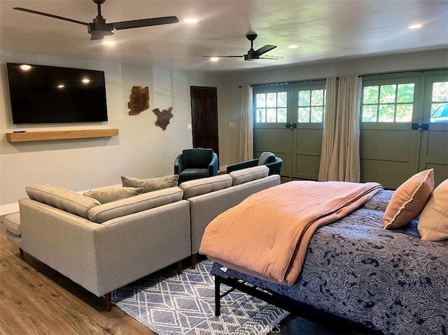 bedroom featuring ceiling fan, wood finished floors, and recessed lighting