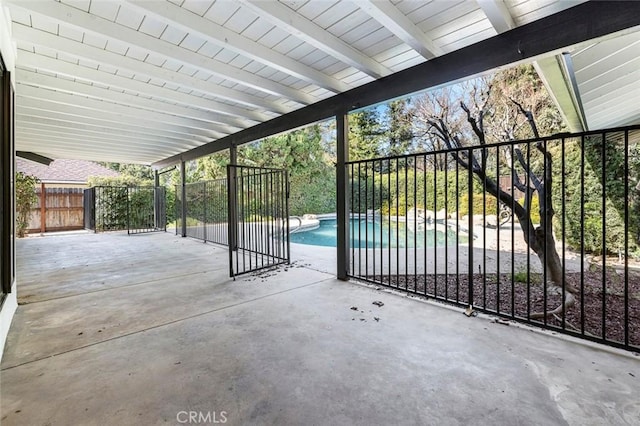 view of patio featuring fence and a fenced in pool