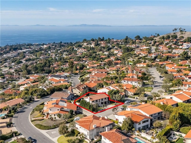 birds eye view of property featuring a water view and a residential view