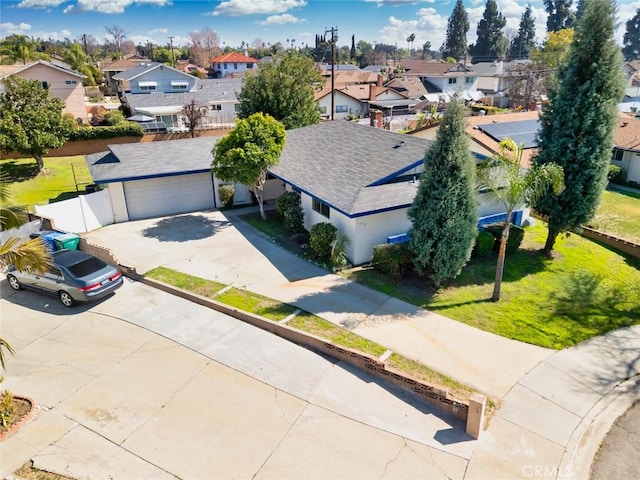 birds eye view of property with a residential view