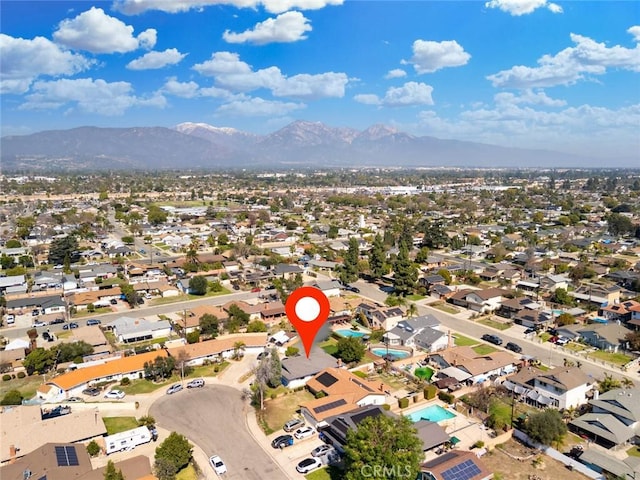 birds eye view of property with a residential view and a mountain view