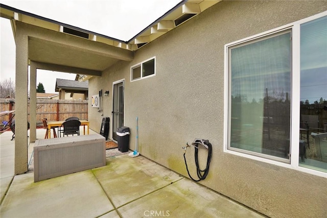 view of patio / terrace featuring fence