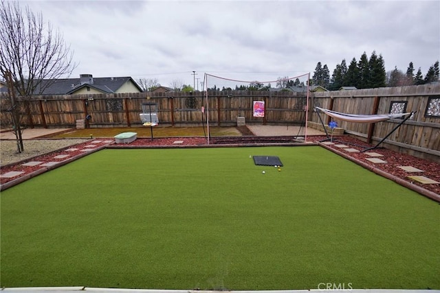 view of property's community featuring a fenced backyard