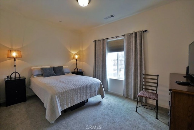 bedroom featuring carpet floors and visible vents