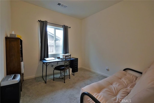 home office with light carpet, visible vents, and baseboards