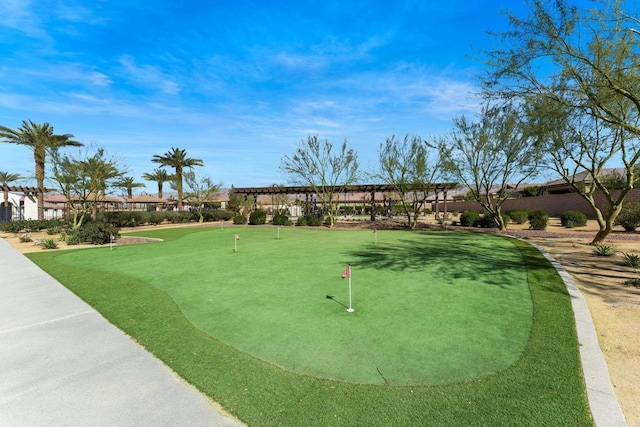 view of community with fence and a pergola