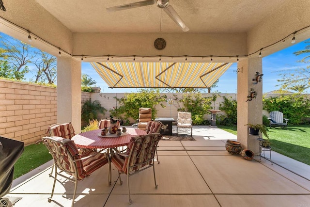 view of patio / terrace with a ceiling fan, outdoor dining space, and a fenced backyard